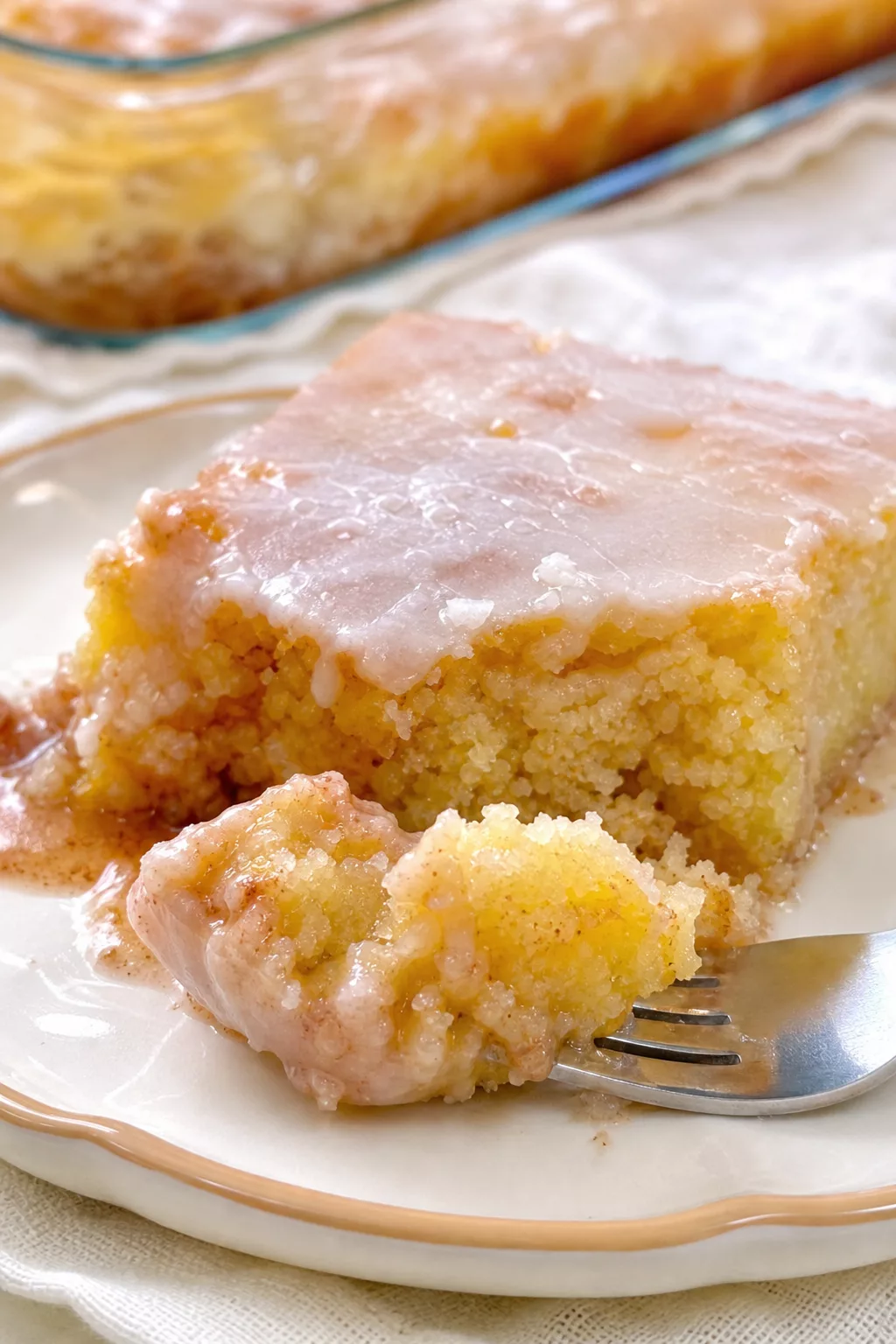 Homemade Cinnamon Roll Cake close-up serving shot